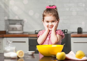 cute little girl baker on kitchen with baking ingredients
