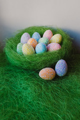Easter eggs on green background
