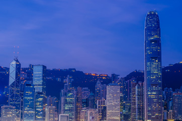 Fototapeta na wymiar Hong Kong city office building over Victoria bay during sunrise