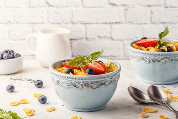 Healthy breakfast - corn flakes with fruits and berries.