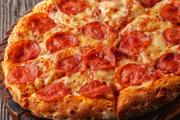 Pepperoni pizza with mozzarella cheese and tomato sauce