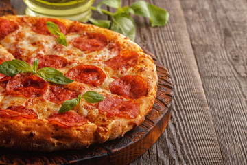 Pepperoni pizza with mozzarella cheese and tomato sauce