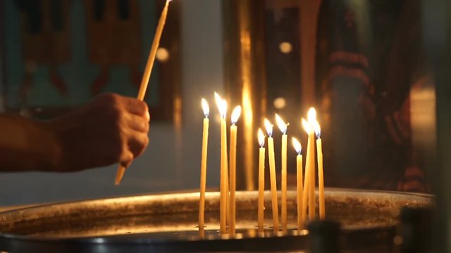 Close-up of burning candles in the monastery