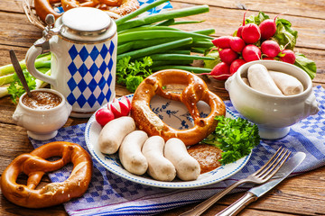 White sausages with sweet mustard and pretzel