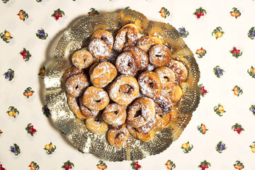 fried donuts of Spain made with dough of flour , yeast, milk, eggs,oil, orange, anise and sugar