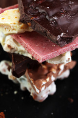 Melting chocolate and diffrent bars - stack and chips with choco