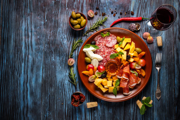 Italian food cooking ingredients on dark rustic wooden background, top view