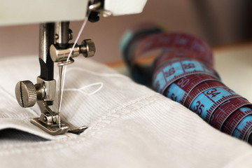 The sewing machine needle closeup