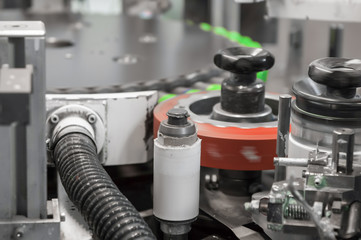 the machine prints on plastic lids. printing on plastic caps