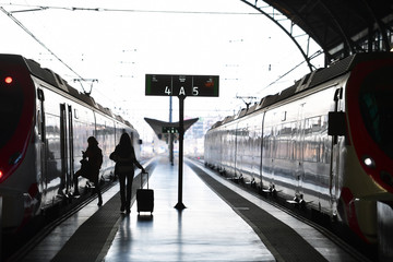 Fototapeta premium Silhouette on the railway platform in the morning 
