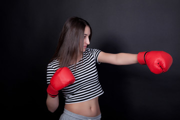 Woman imitates blow with boxing gloves