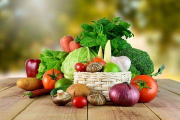 Fresh vegetables on wooden and blur background.