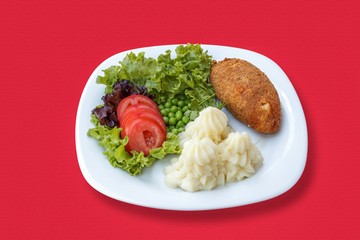 Mashed potatoes with cutlet and vegetables