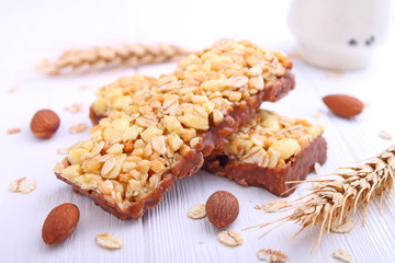 healthy snack, muesli bars with raisins and nuts on a white background