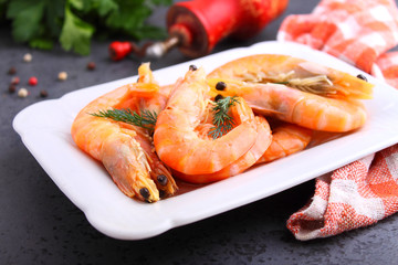 shrimp and dill on a black background