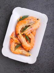 shrimp and dill on a black background