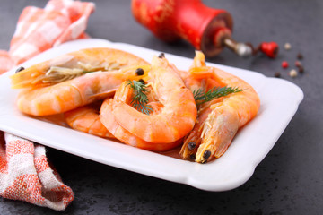 shrimp and dill on a black background