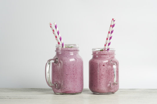 Raspberry and blueberry smoothie with yoghurt and protein