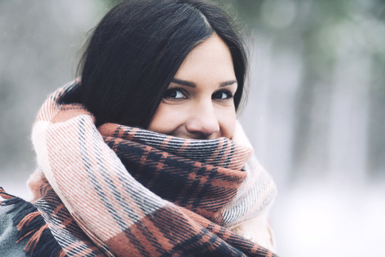 Close up portrait of woman wrapped in scarf