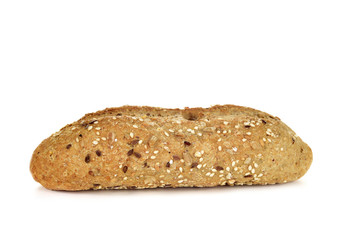wholemeal bread roll topped with different seeds