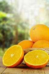 Fresh oranges fruit and blurred nature background.