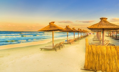 Chairs, Black sea and umbrella in Mamaia Holiday Resort, Romania.