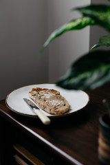 Slice of Buttered Toast on Dark Wooden Table