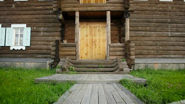 The front door, a wooden log fence. Panorama from the down top. HD.
