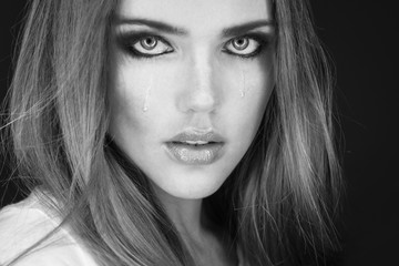 Beauty portrait of a brunette girl with black straight hair.