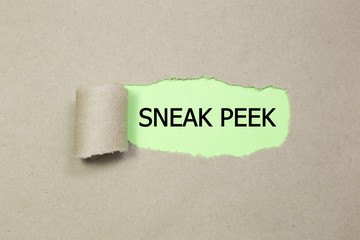 The phrase Sneak Peek appearing behind torn brown paper.