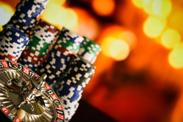 Casino Concept background with dice, golden coins, cards, roulette and chips.
