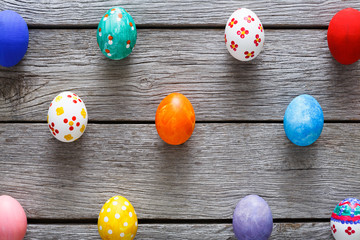 Colorful easter eggs on wood background