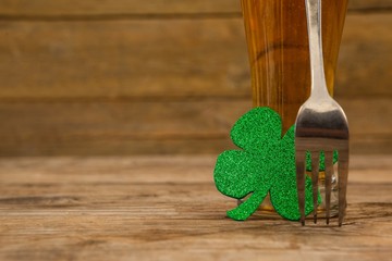 Glass of beer, fork and shamrock for St Patricks Day - Powered by Adobe