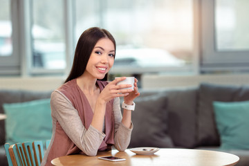 Young beautiful woman in cafe
