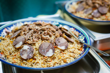Uzbek national dish pilaf on plate