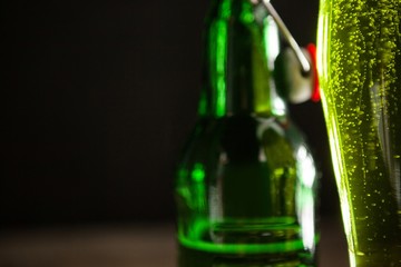 Glass of green beer and beer bottle for St Patricks Day