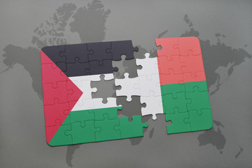 puzzle with the national flag of palestine and madagascar on a world map