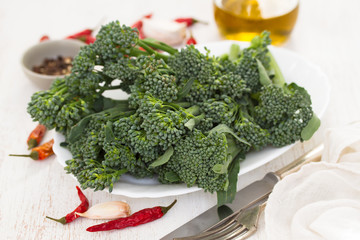 fresh greens of broccoli on dish