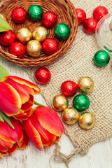red tulips on wooden background