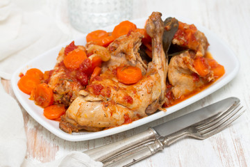 rabbit stew with carrot on white dish