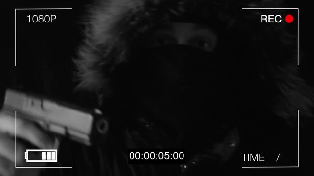 the masked robber shows on a hidden camera the middle finger