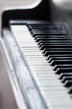 an old piano keys with a selective focus