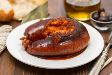 grilled poartuguese sausage farinheira on white plate