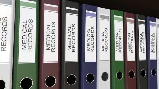 Line of multicolor office binders with Medical records tags. 4K seamless loop clip