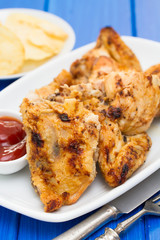 grilled chicken with sauce on dish
