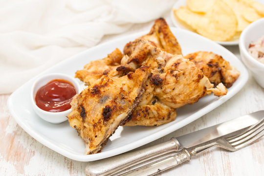 grilled chicken with sauce on dish