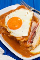 portuguese sandwich francesinha with fried egg