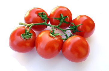 Fresh tomatoes over white background