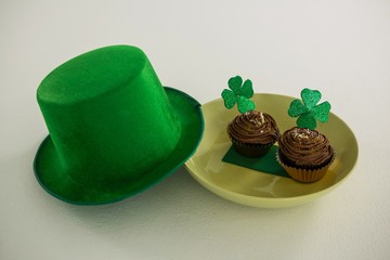 St Patricks Day leprechaun hat with shamrock on cupcake