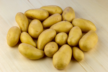 Small Organic Potatoes on a Wooden Table